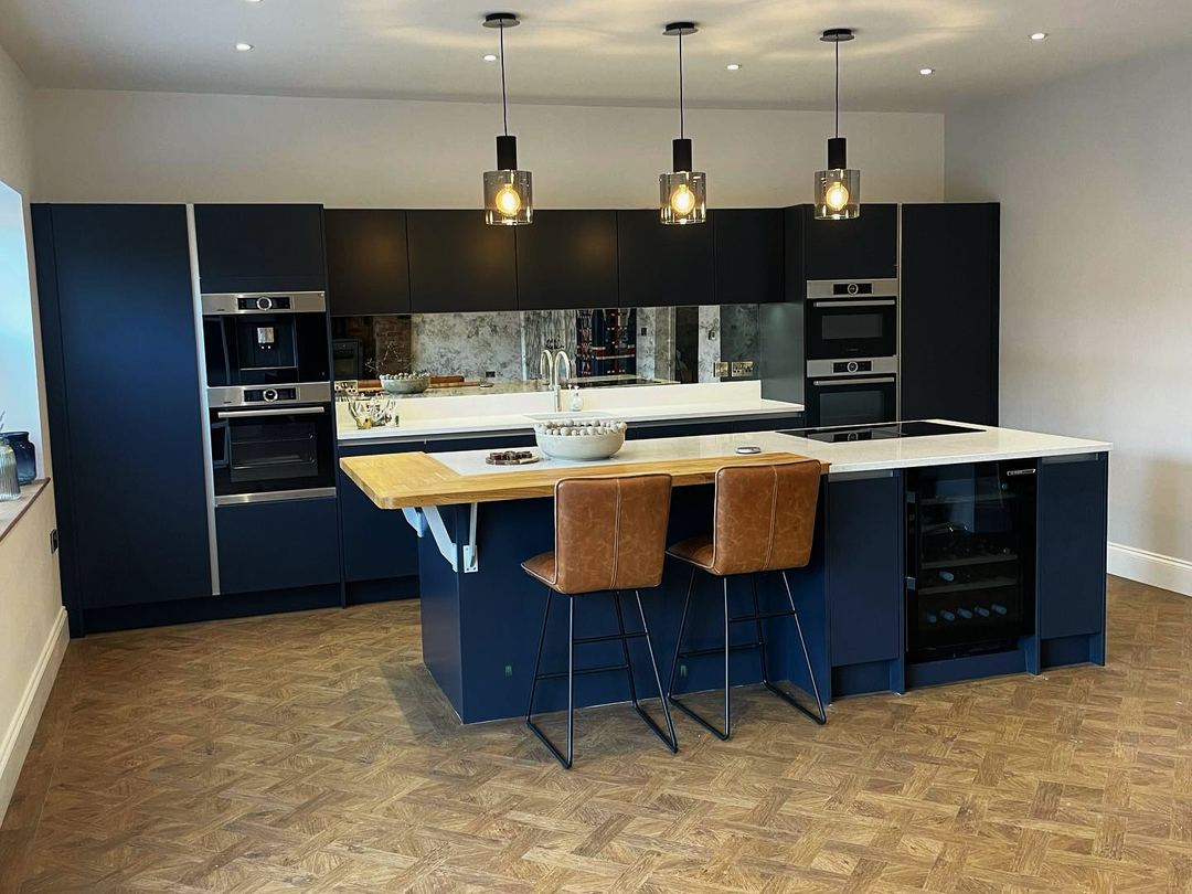 Mid blue kitchen with a quartz island