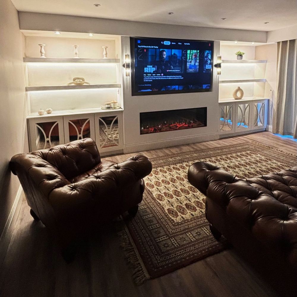 White media wall with built-in shelving in a living room in Humberston